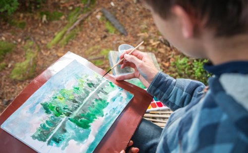 A boy painting.