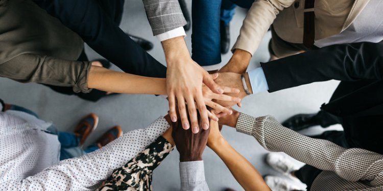 diverse hands grasping each other