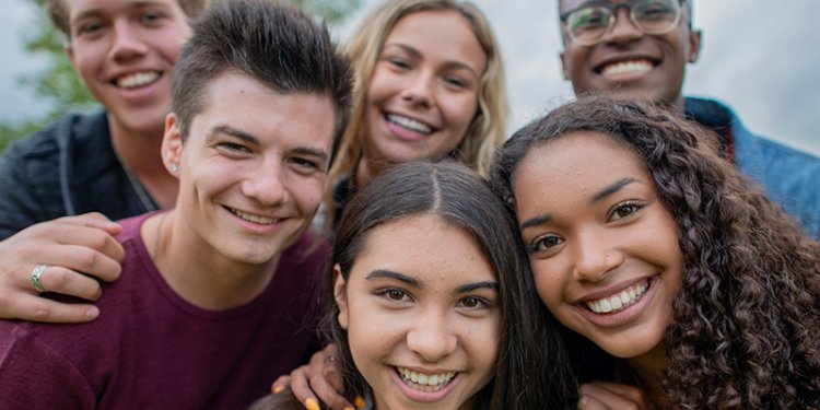 group of diverse teens smiling