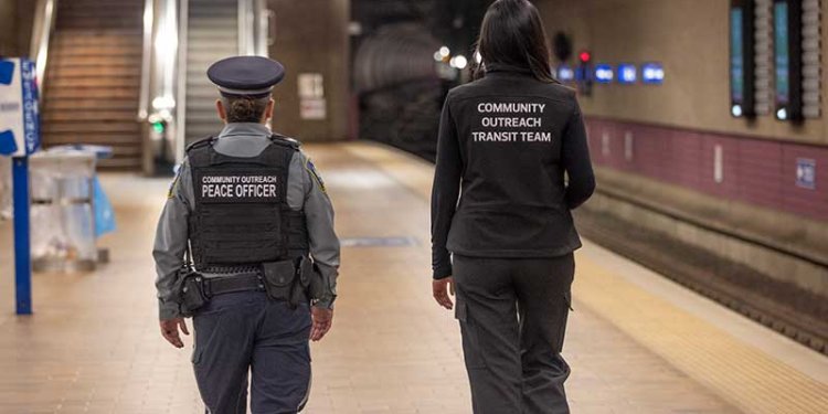 two enforcement officers walking