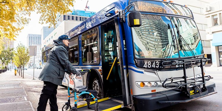 Senior with walker entering ETS Bus using accessibility ramp