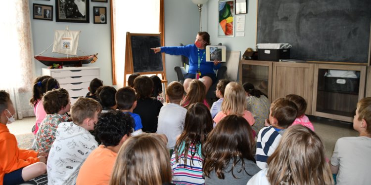 person with group of children at John Walter museum