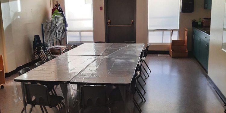 small room with table and chairs