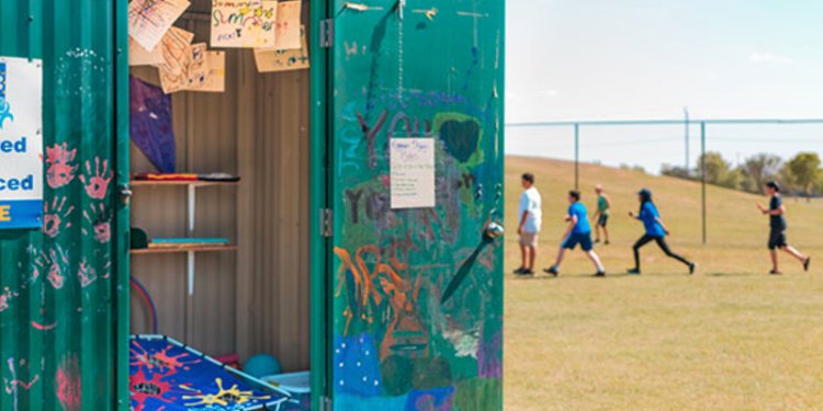 green shack building in park
