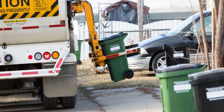 waste truck lifting garbage cart