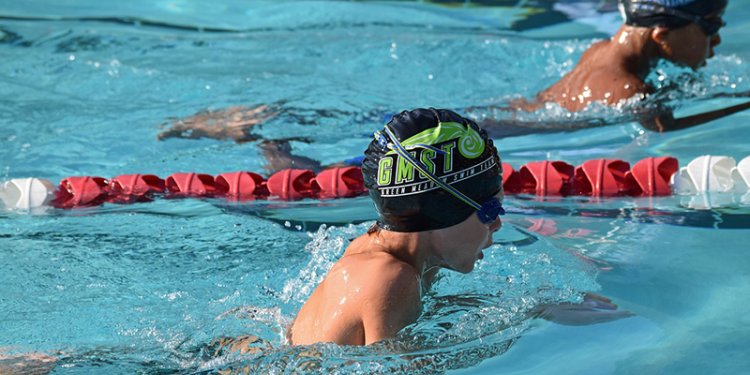 Young swimmer in their lane during a race