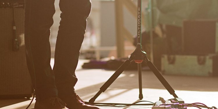 person on stage with equipment