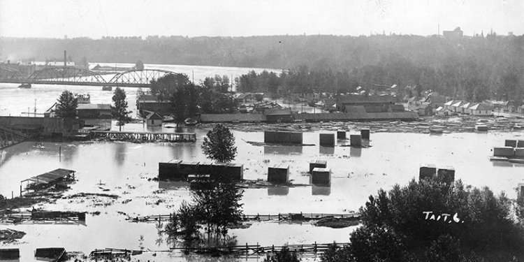 flood waters covering houses and land