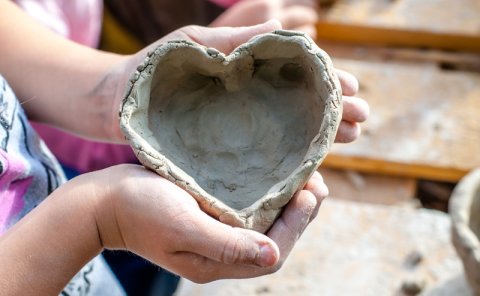 person with clay
