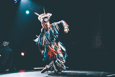 person in indigenous headgear and clothing