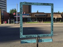 blue metal frame facing the road and businesses