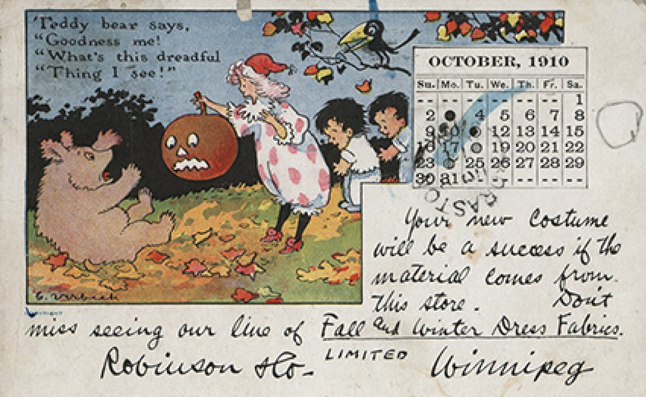 A postcard from 1910, featuring a cartoon of a girl holding a jack-o'-lantern,  and a bear who is saying "Goodness me! What's this dreadful thing I see?"