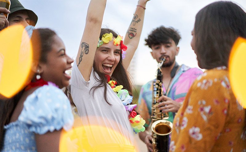 diverse persons dancing and partying