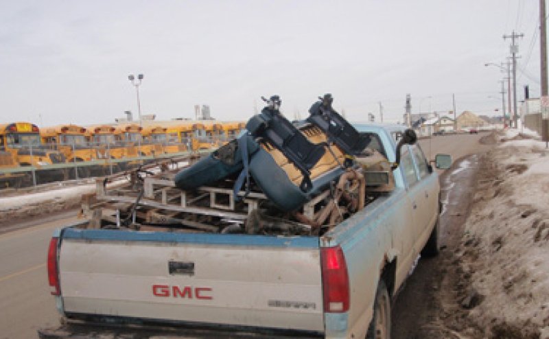 A truck bed filled with a full unsecured load 
