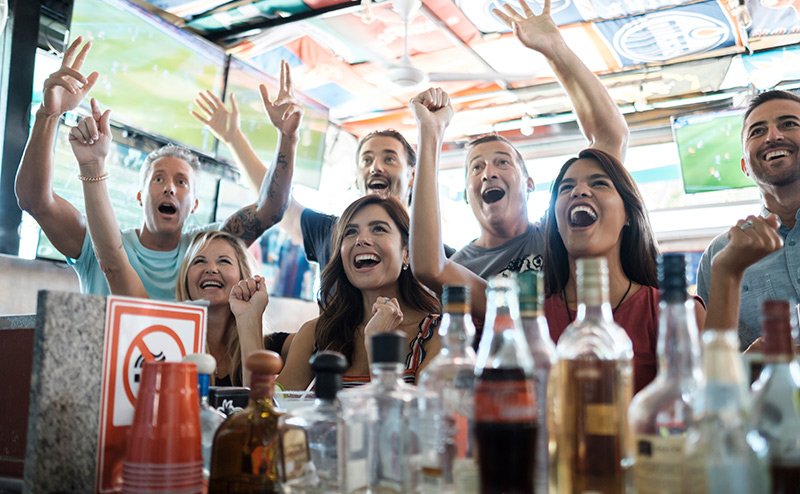 excited people in bar