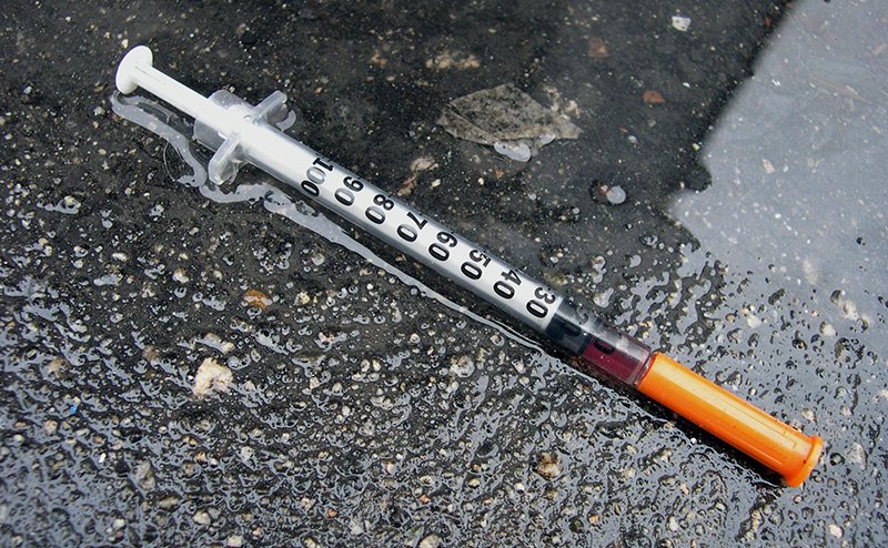 used needle on the ground