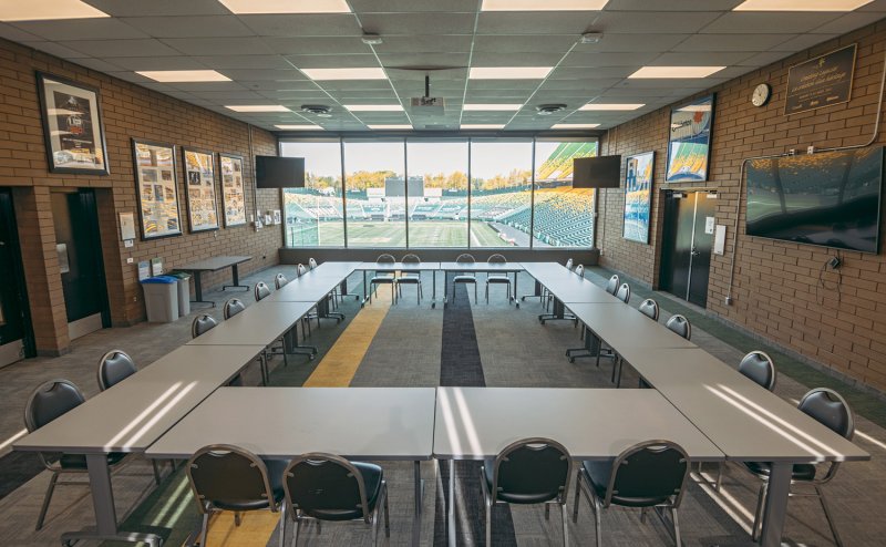 commonwealth meeting room with tables and chairs in a square