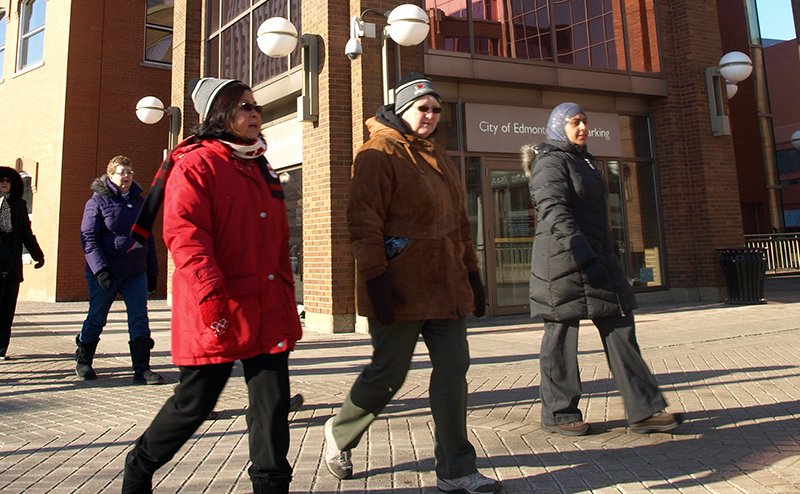 Three people walking in winter