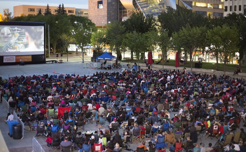 Large group of people watching a movie in Churchill Square
