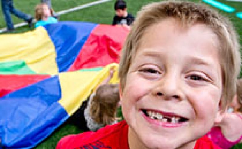 Kids playing with parachute