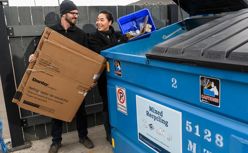 lady and man with recycling