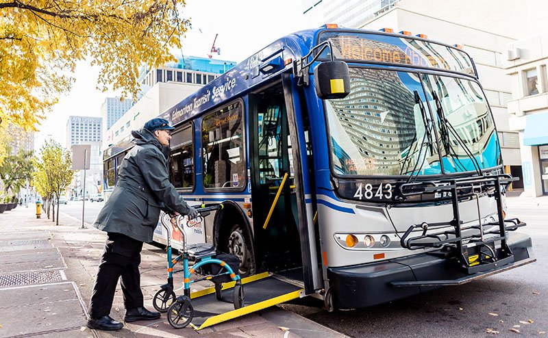 Person with walker boarding bus