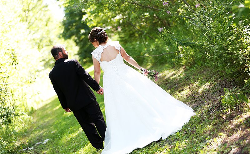 bride and groom in park