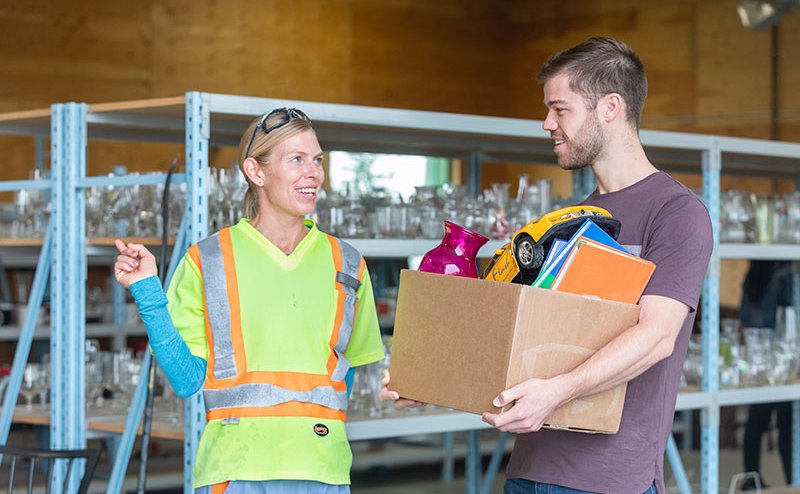 resident taking items to eco station