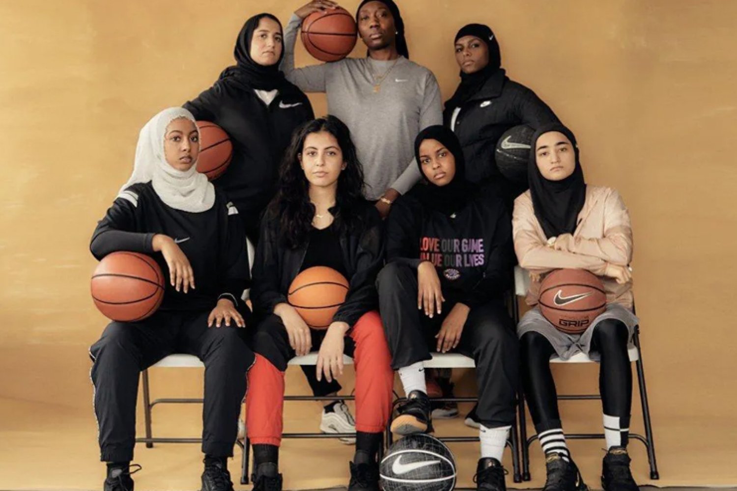 Muslim female basketball players pose for a photo.