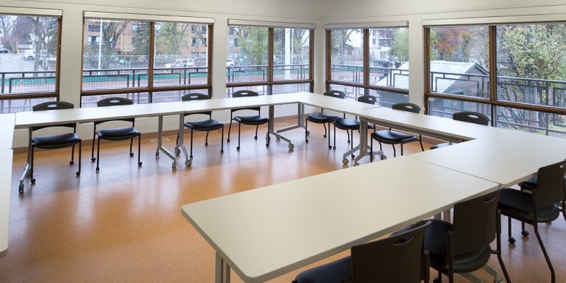 room with open square layout and chairs