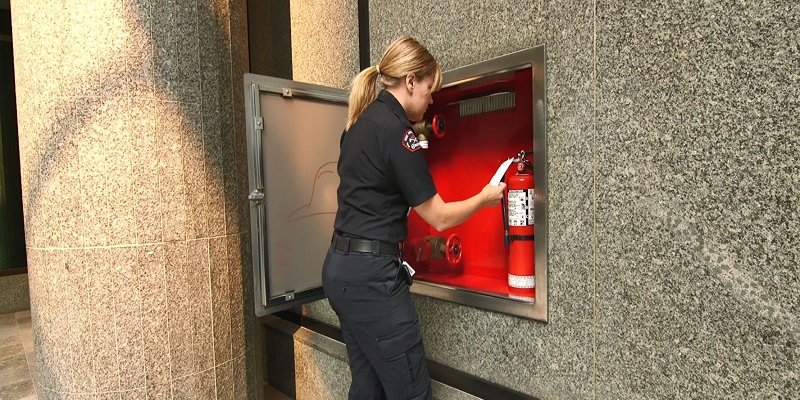 fireperson with fire extinguisher