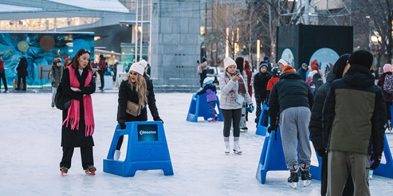 Skating outside City Hall in winter