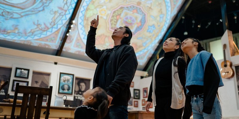 People looking at displays in Fort Edmonton Park.