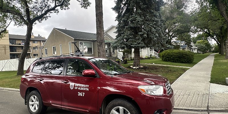 Red car with U of A logo