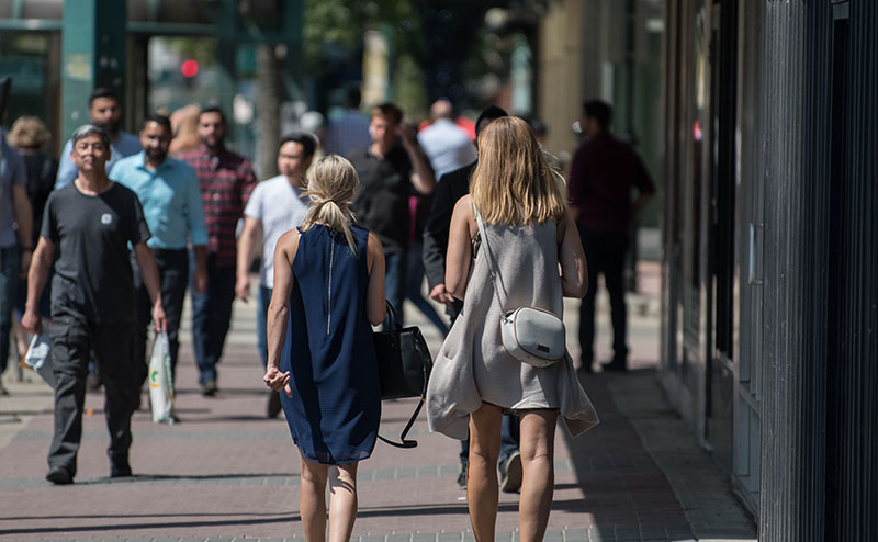 People walking along Jasper Avenue in downtown Edmonton