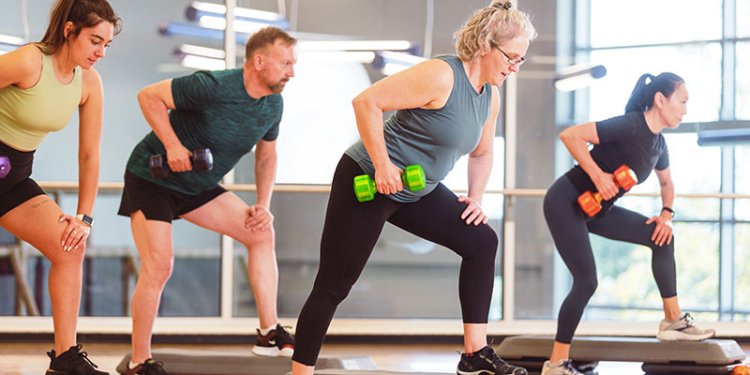 people in gym using exercise weights