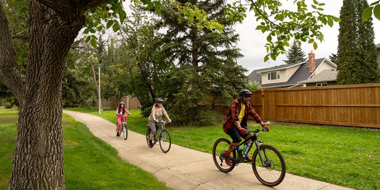 family biking on trail
