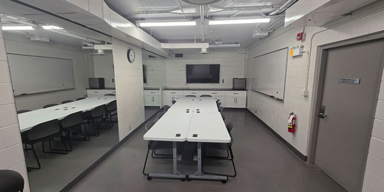 meeting  room with rectangular tables and kitchenette