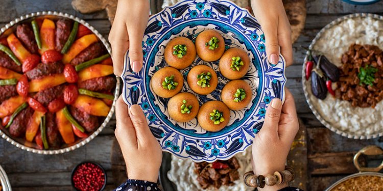 persons sharing a meal during Ramadan