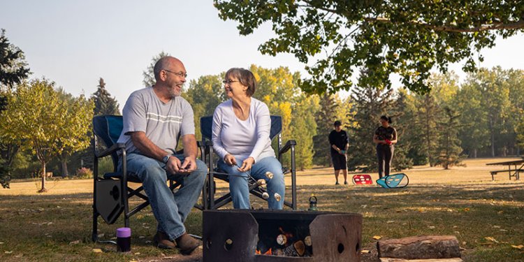 Family picnic with marshmallow roasting and games