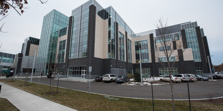 university office building and cars in parking lot