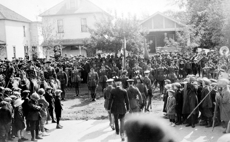 Soldiers in Edmonton, surrounded by a crowd of onlookers. 