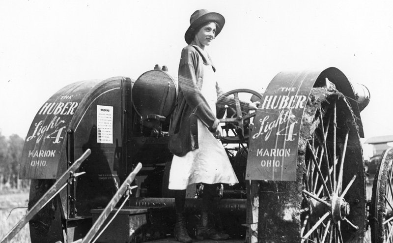 A woman on a tractor.