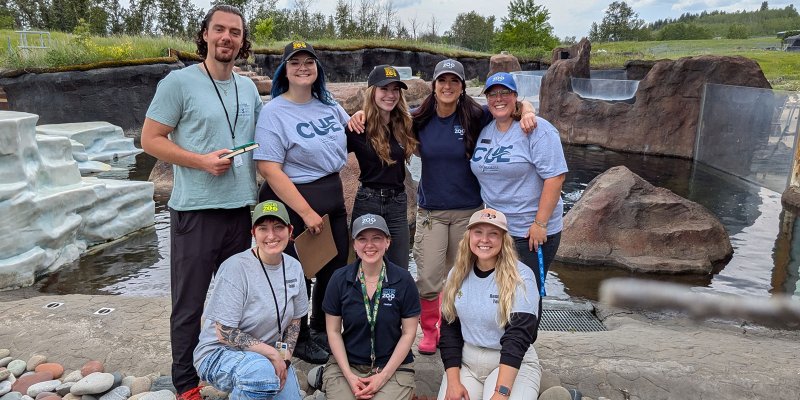 team of zoo staff standing and posing for the camera